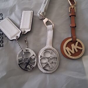 2 Coach White and Silver Logo Charm Keychain Set And 1 MK brown Leather